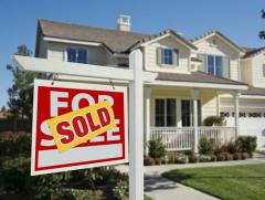 House with for sale sign